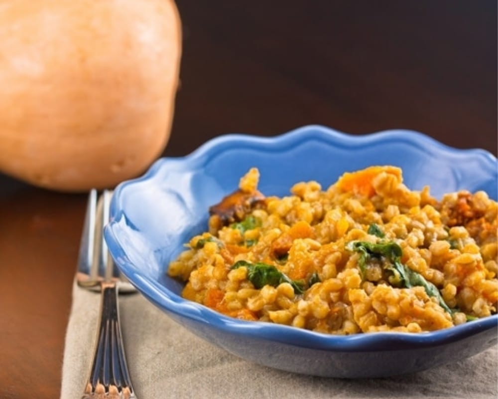 Roast Butternut Pumpkin, Spinach & Barley Risotto in a bowl next to a fork