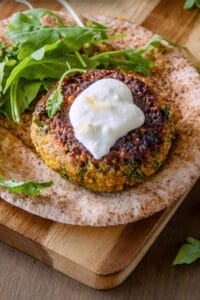 Spiced millet and chickpea burgers with preserved lemon yoghurt