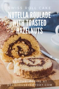 Nutella Roulade (swiss roll cake) with toasted hazelnuts