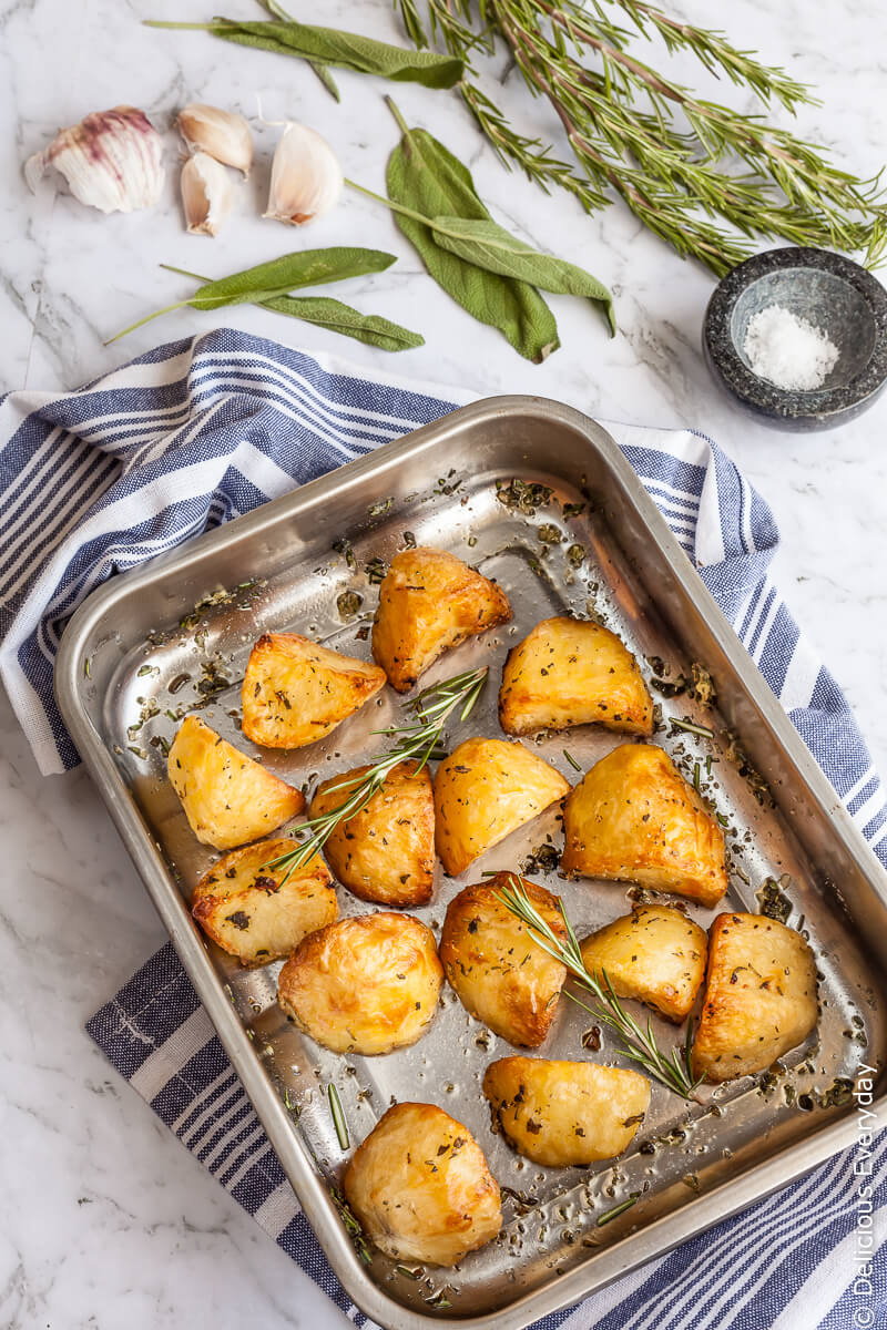 Planning on making roast potatoes this Christmas? Learn my secrets for crunchy, golden and crispy roast potatoes with rosemary, sage and garlic.