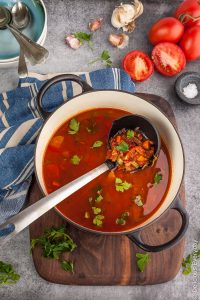 This rustic Smoky Tomato Soup is packed with vegetables and roasted peppers and spices. Flavourful, speedy and healthy this soup is a great weeknight meal.