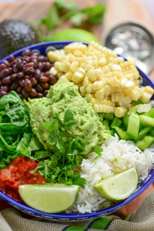 close up of vegan burrito bowl with veggie toppings