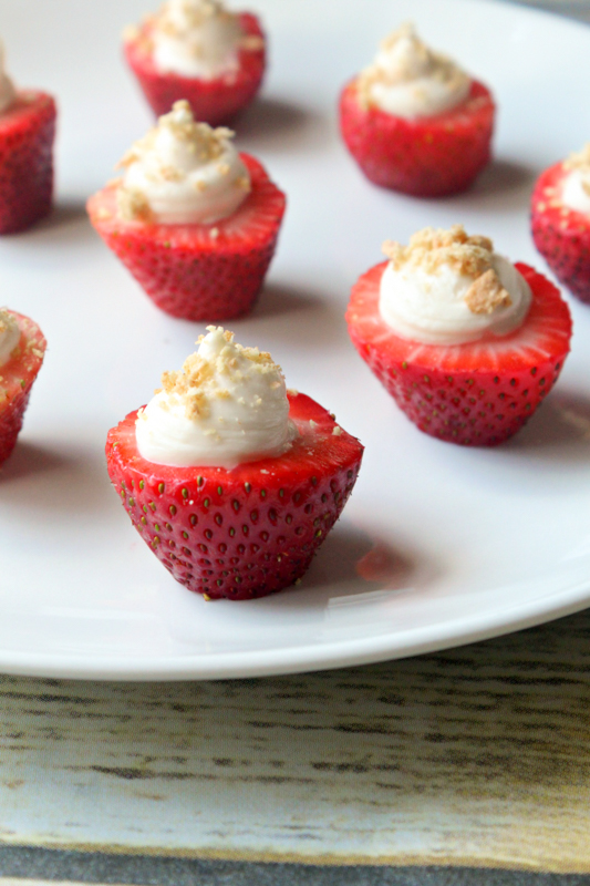 strawberry cheesecake bites on a white plate