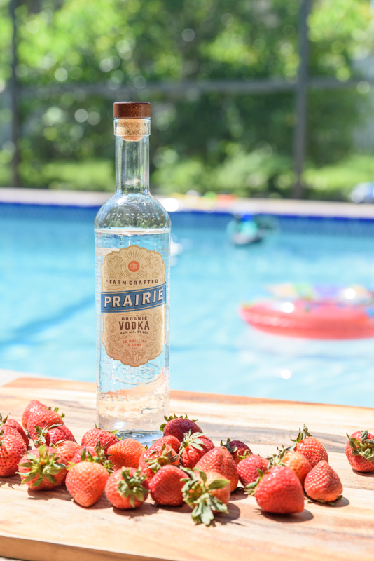 vodka and strawberries by the pool