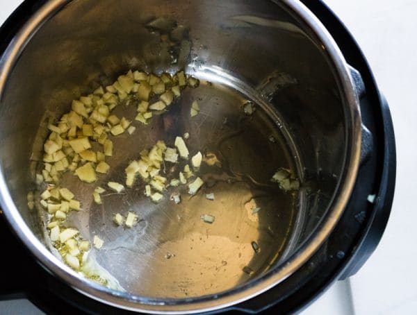 garlic and ginger cooking in the instant pot