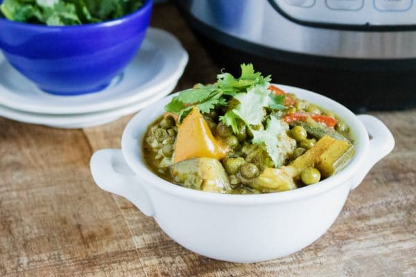 instant pot vegetable curry in white serving dish