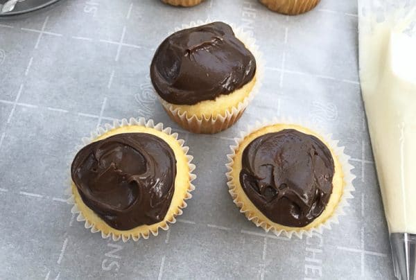 frosting football cupcakes with chocolate frosting