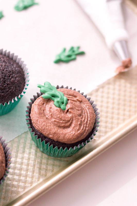 chocolate cupcake decorated with a holly leaf