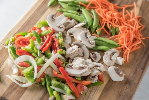 chopping vegetables for vegan stir fry