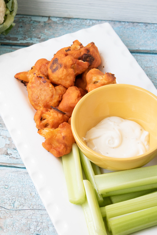 serving cauliflower buffalo wings with ranch dressing