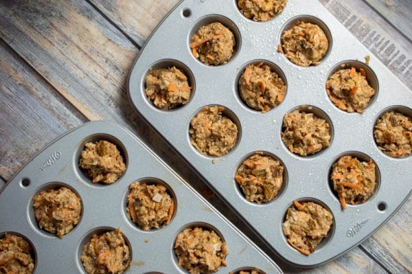 filling muffin tins with carrot muffin batter