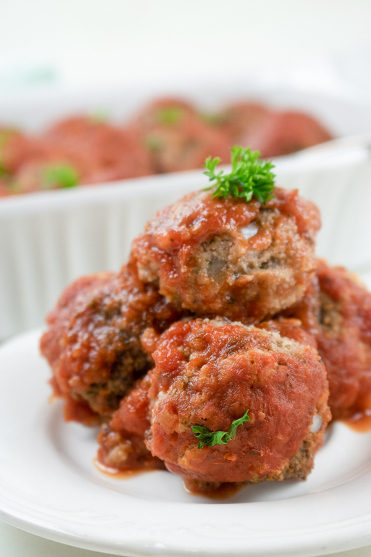 vegan meatballs stacked on a  serving dish
