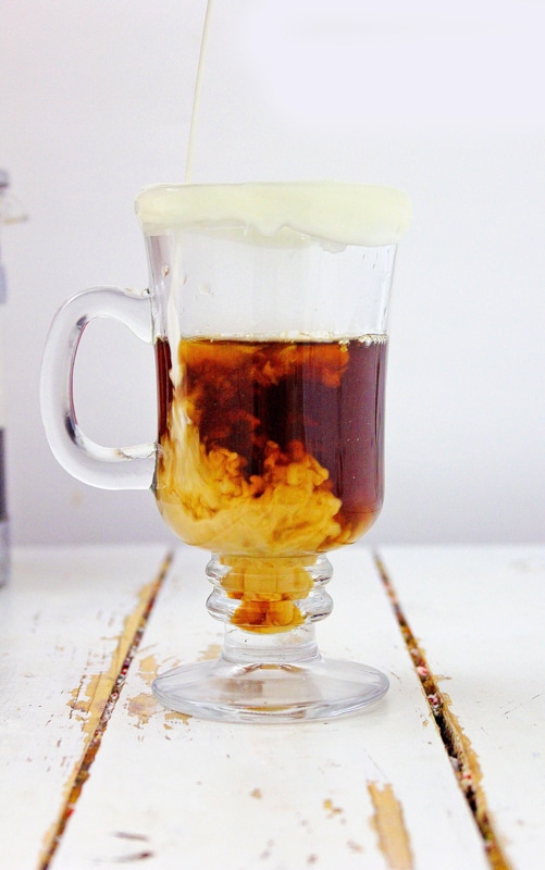 freshly brewed coffee and almond milk in vegan pumpkin spice latte