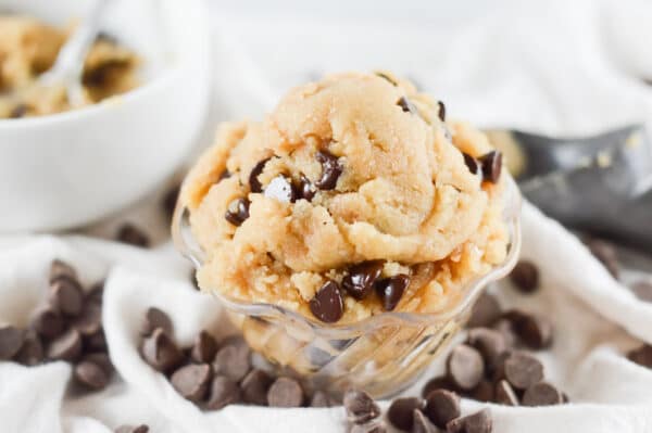 edible cookie dough being served in a glass bowl