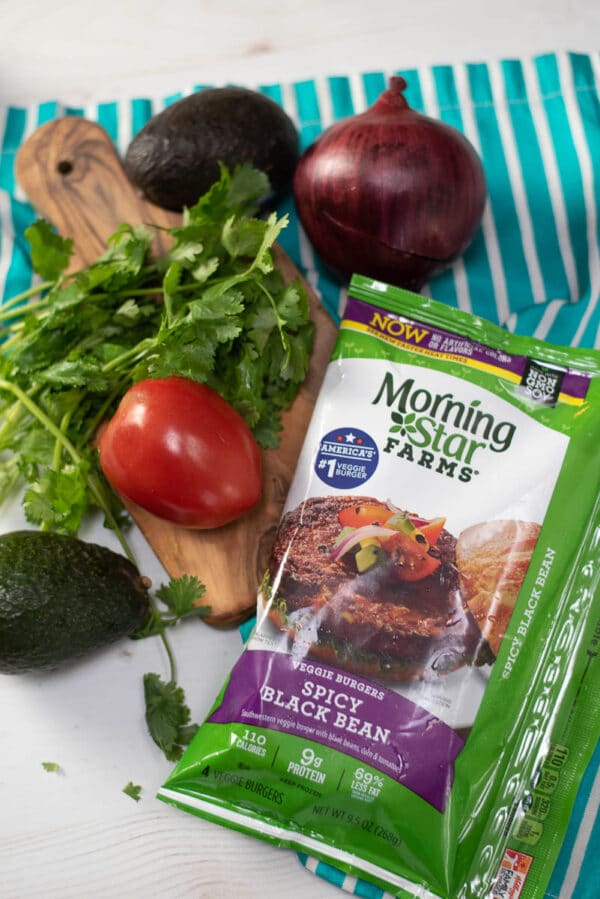 package of MorningStar Farms veggie burgers surrounded by fresh veggies