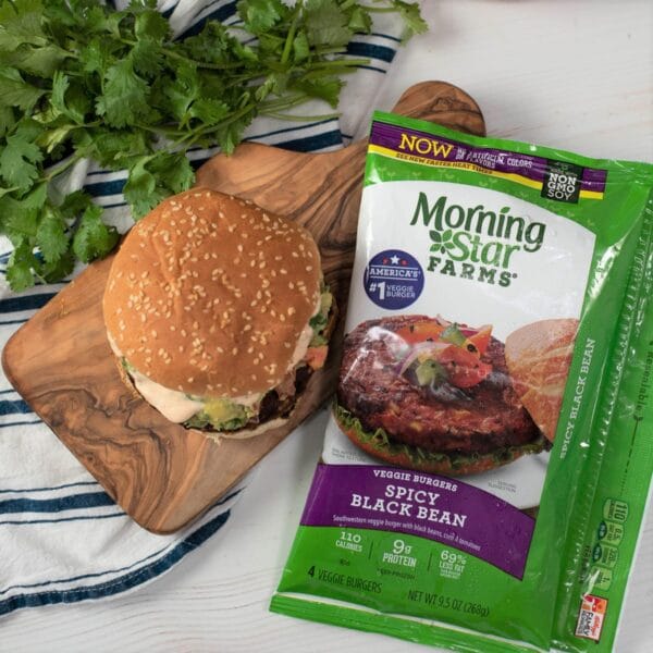 veggie burger being served next to a package of black bean burgers