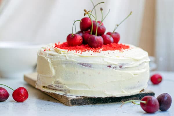 vegan red velvet cake, topped with cherries