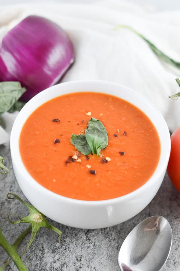 vegan tomato soup in a white bowl