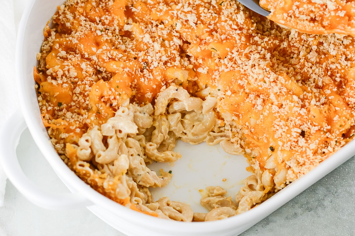 baked vegan mac and cheese with a spoonful scooped out
