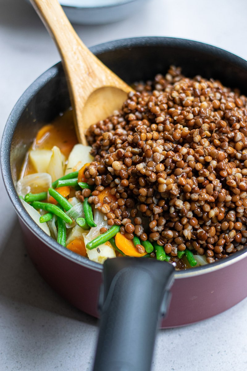 vegan lentil soup cooking in pot
