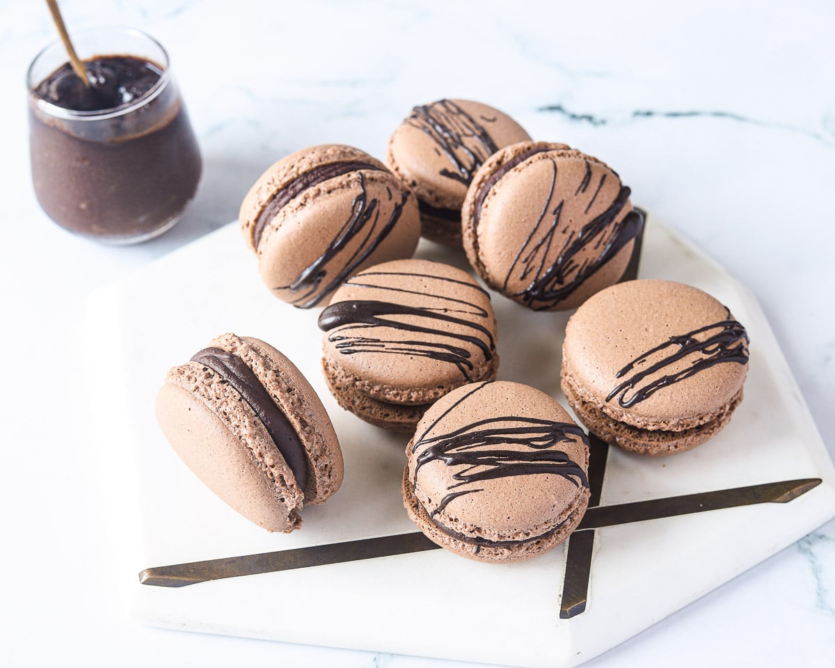 side view of tray of chocolate macarons