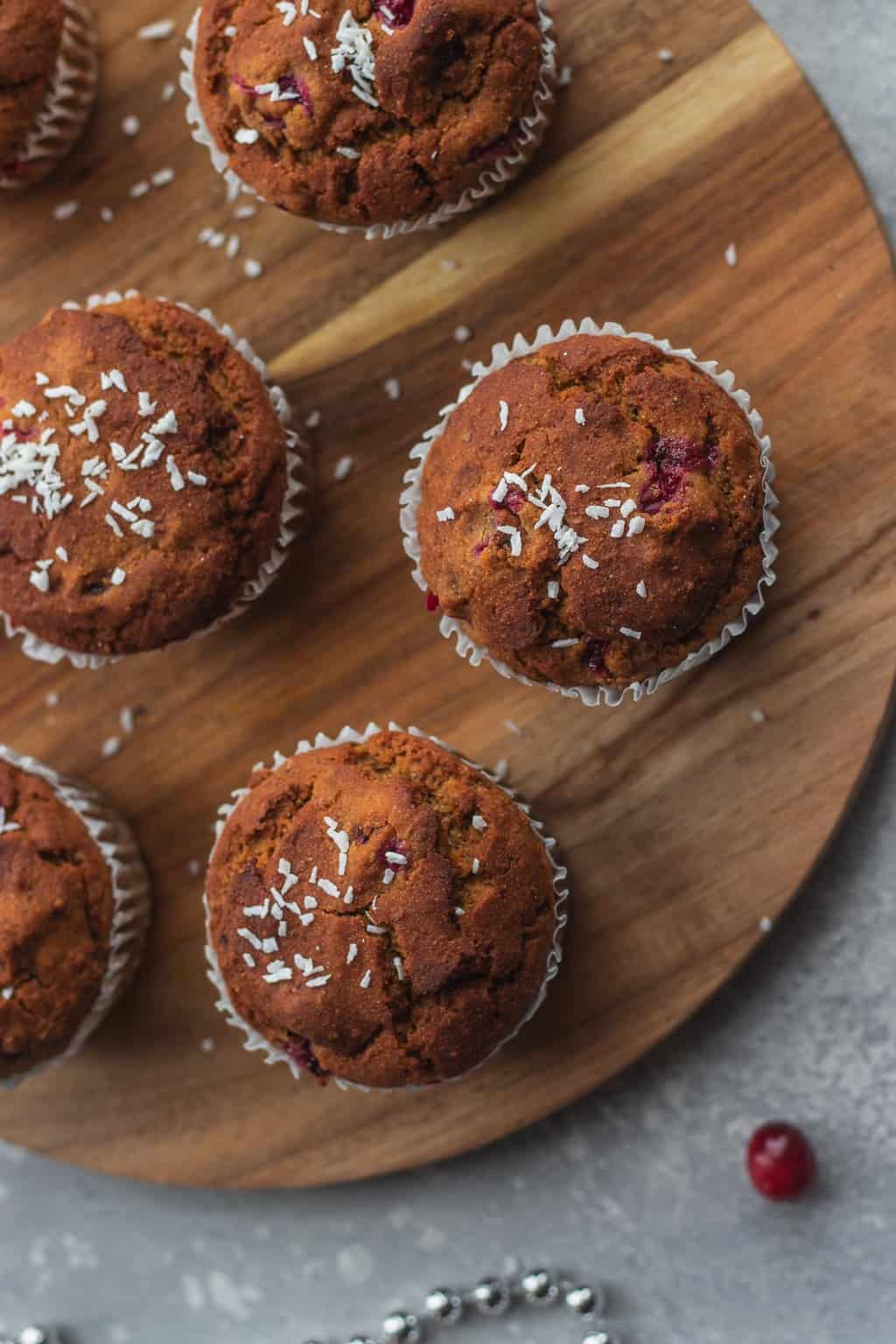 muffins topped with coconut and cranberries