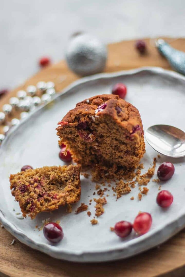 cranberry orange muffin sliced open on a plate