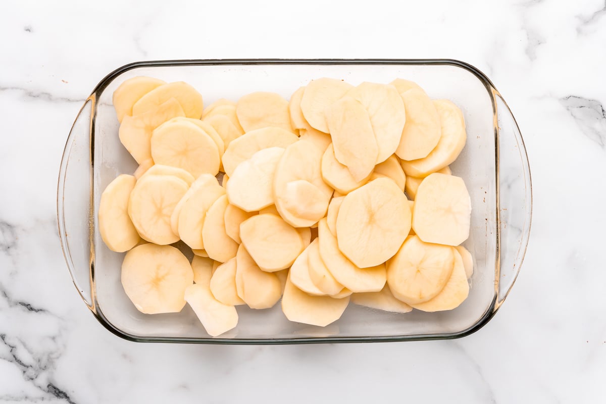 Layer the potatoes in the pan