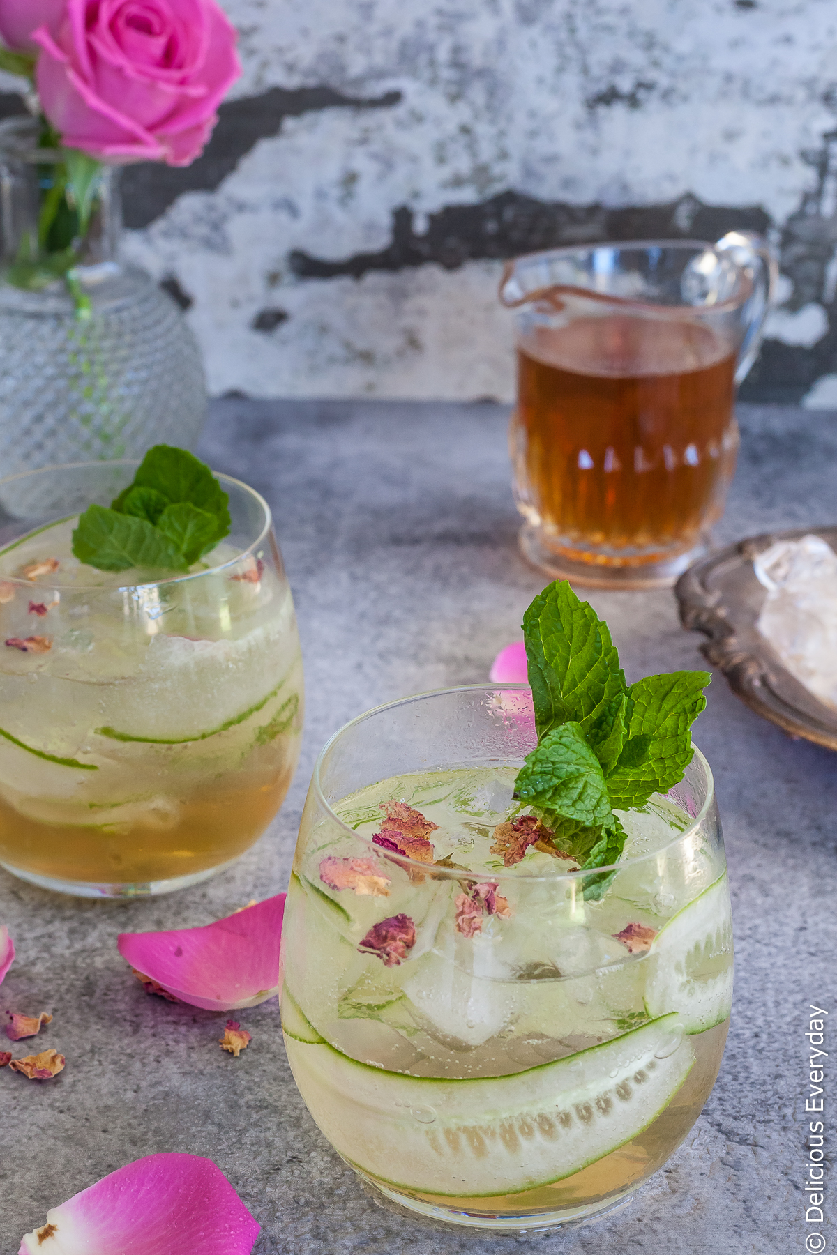 This delicately perfumed light, fizzy Rose and Cucumber Collins cocktail is a perfect pre-dinner sipper. With refreshing cucumber and a homemade rosewater syrup it is the perfect compliment to aromatic gin.