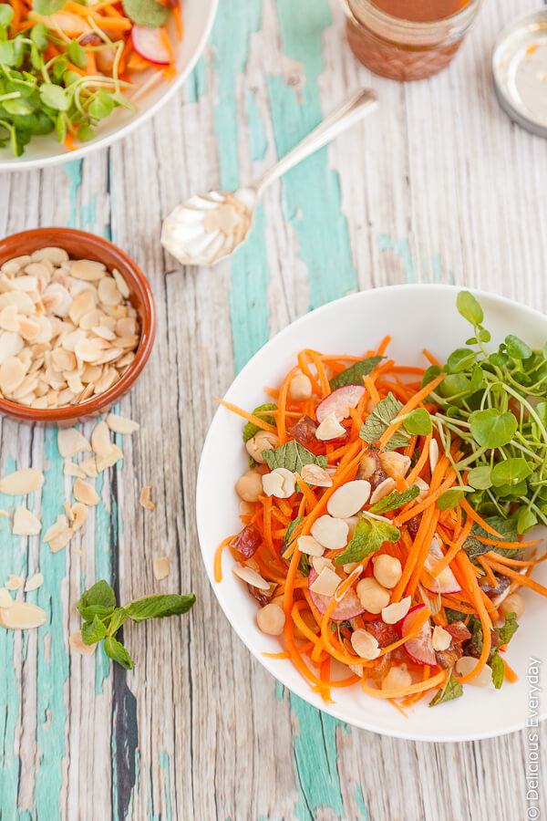 This vegetarian Moroccan carrot salad is divine mix of spices, honey dates and chickpeas. Top with toasted flaked almonds.