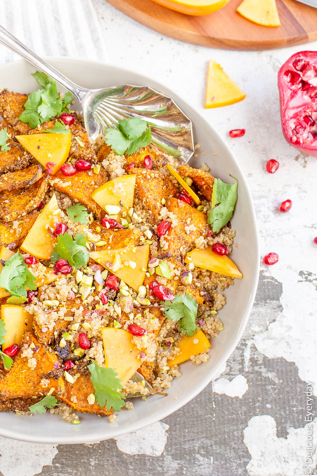 A beautifully vibrant and flavourful vegan quinoa pilaf to celebrate the arrival of Autumn with the Autumnal flavours of pumpkin, pomegranate and persimmon. | Click for the recipe