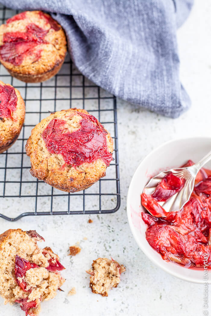 Rhubarb and Strawberry Whole Wheat Muffins - delicious roasted strawberries and rhubarb come together with whole wheat spelt flour and a rhubarb and strawberry compote for a decadent weekend breakfast. Freshly baked muffins for breakfast. Yes please! 