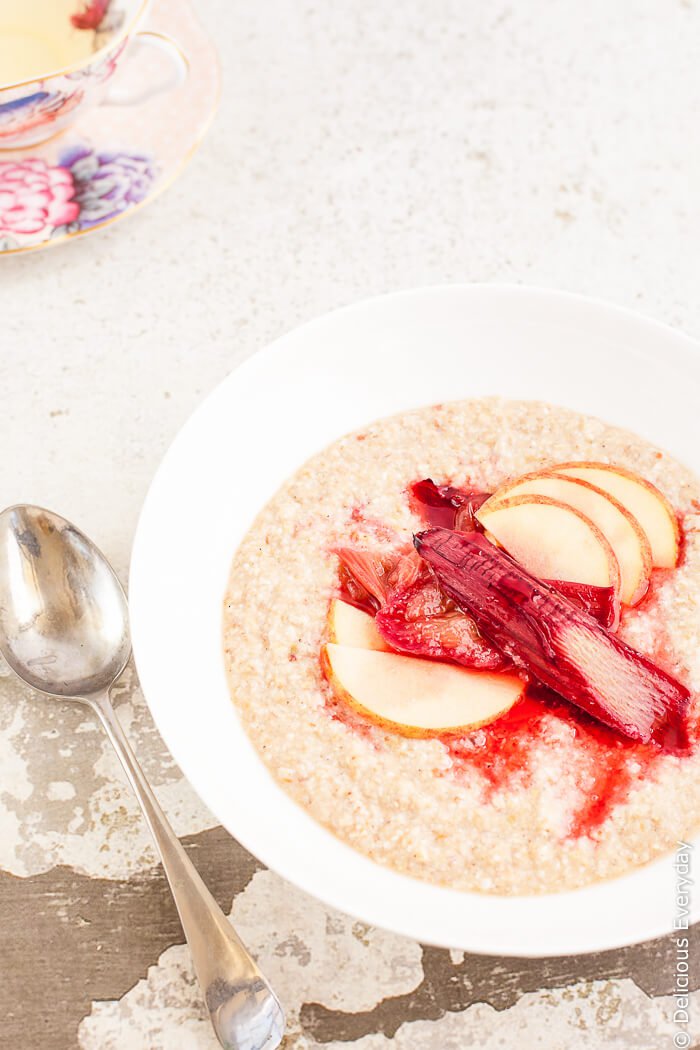 Maple Roasted Rhubarb Buckwheat Porridge Recipe - Ruby hued rhubarb is roasted in maple syrup until soft and luscious and served on a bed of apple buckwheat porridge for a healthy and satisfying way to start your day. | click for the recipe