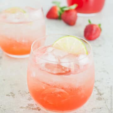 A beautiful homemade simple syrup (or cordial) made from fresh strawberries, rhubarb and lime. Add this gorgeous strawberry, lime and rhubarb syrup to sparkling water for a wonderful refreshing drink which also works wonderfully with a splash of gin! | Click for the recipe