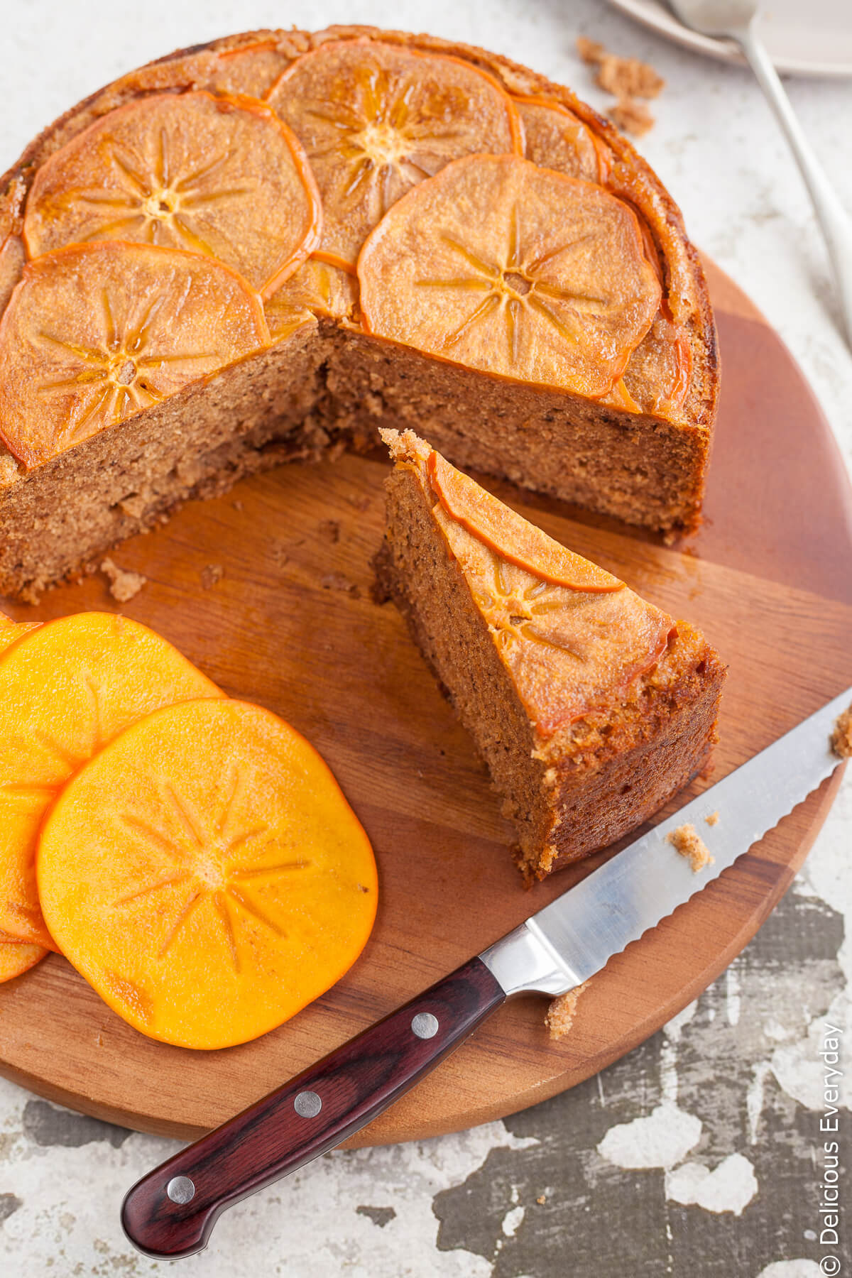 This gorgeous spiced upside down persimmon cake topped with finely sliced persimmon in maple syrup is a great introduction to persimmons. | Click for the recipe