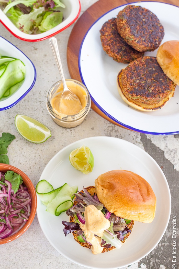These gourmet vegetarian burger patties are packed with the flavours of ginger, lemongrass, carrot and soy. Top these gluten free veggie burgers with lime and coriander (cilantro) onions and sweet chilli sauce and watch them disappear! | Click for the recipe
